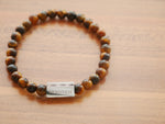 Perle Occhio Di Tigre tiger's eye bracelet, flat lay — product photo