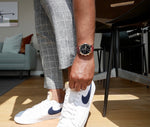 MANHATTAN CHRONO men's watch on wrist with white sneaker — casual lifestyle photo